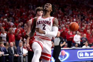 TUCSON, AZ - DECEMBER 09: Arizona Wildcats guard Caleb Love #2 celebrates a dunk during the first half of a men's basketball game between the Wisconsin Badgers and the University of Arizona Wildcats on December 9, 2023 at McKale Center in Tucson, AZ. (Photo by Christopher Hook/Icon Sportswire via Getty Images)